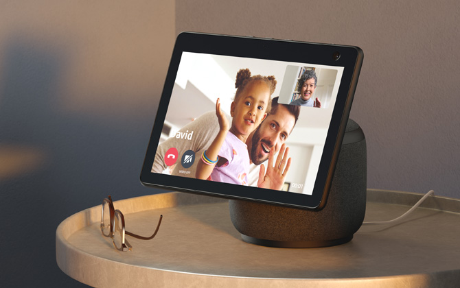 Amazon Echo Show 10 showing a video chat between a man and child and an older woman.