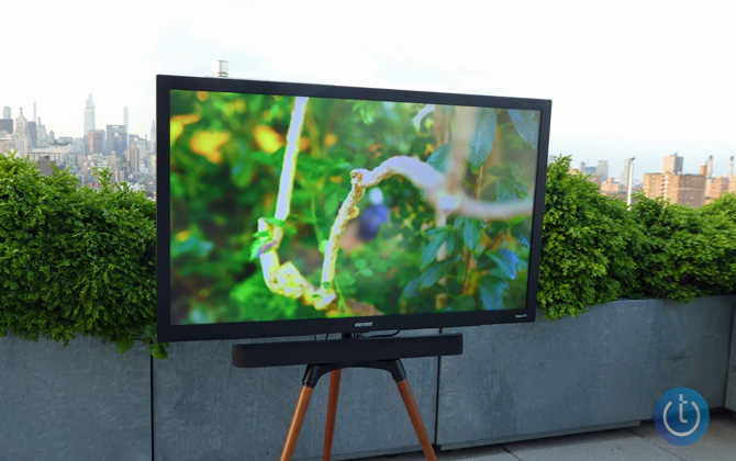 Element Patio Series Roku TV on roof deck in the afternoon sun with the New York skyline in the background.