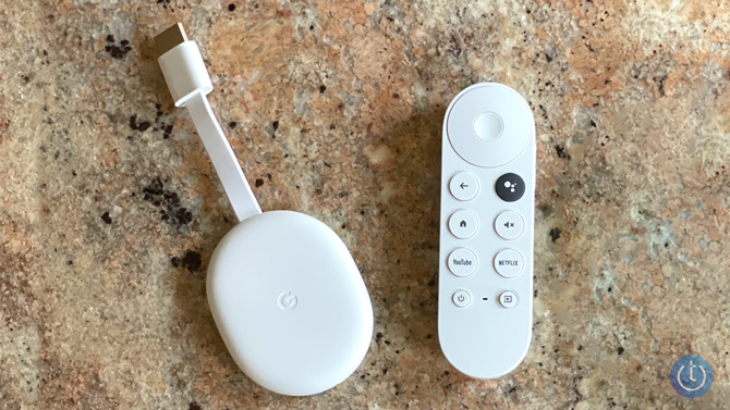 Chromecast with Google TV with its remote control.