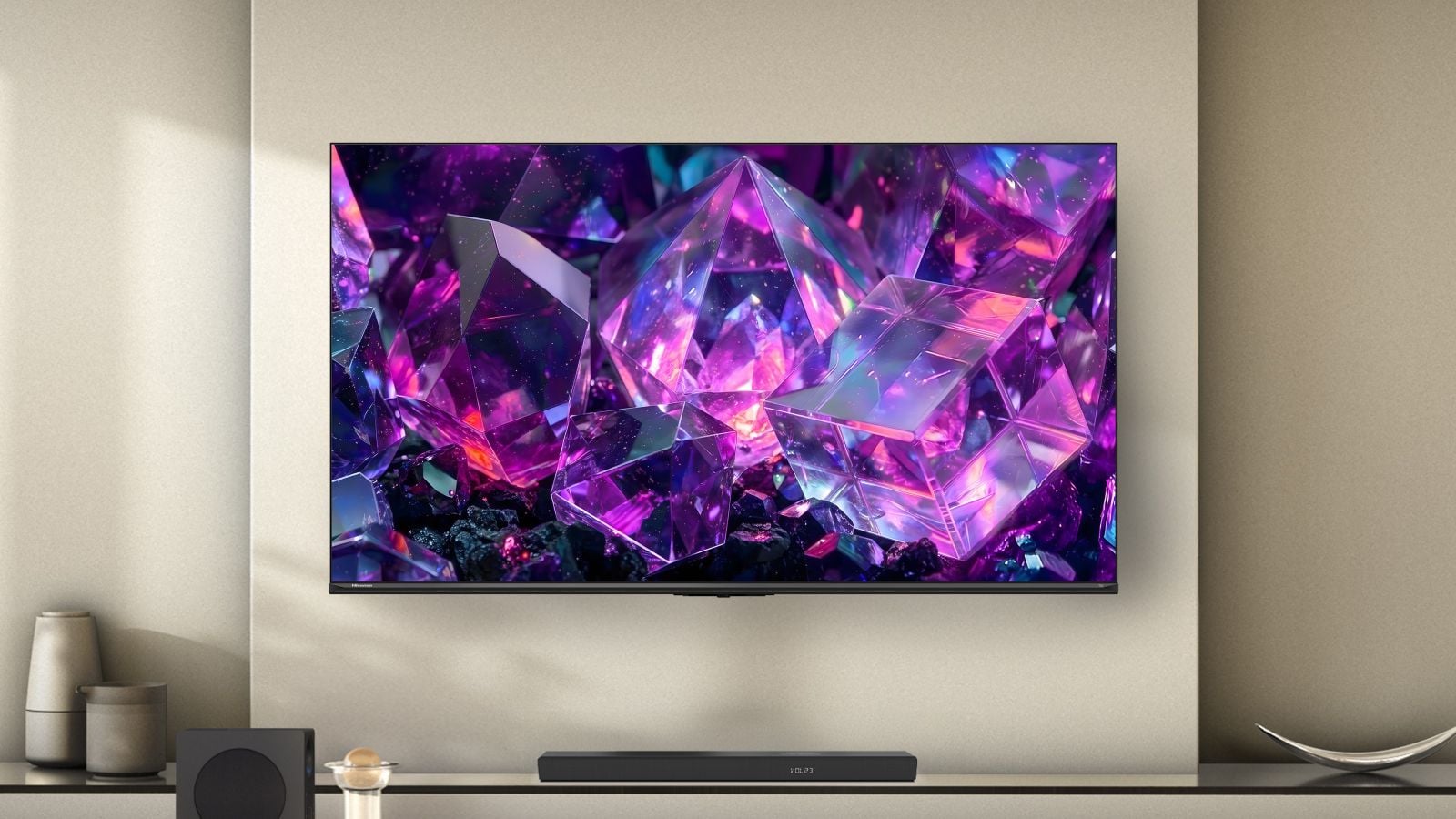 The Hisense E7SF TV hangs on a wall.
