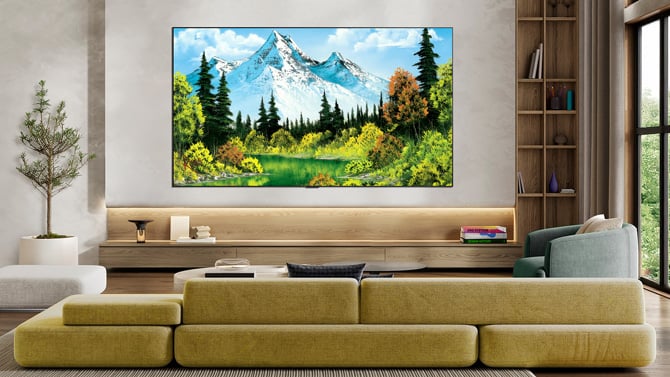 A LG Gallery TV displays a Bob Ross landscape painting of a mountain with trees and happy little clouds.