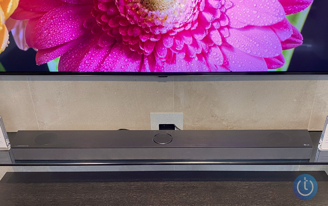 LG S95QR Soundbar shown from the top down on console below a TV