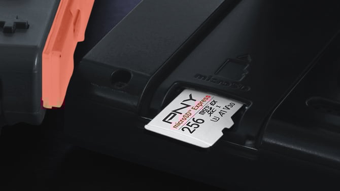 PNY 256GB microSDXC Card sticking out a console for scale