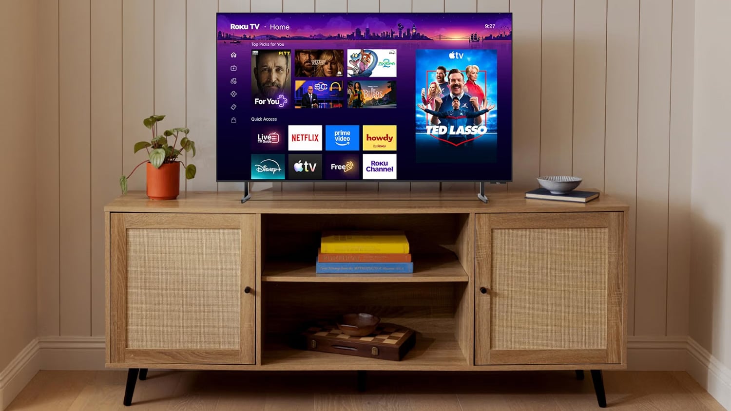 Roku Pro Series TV sits on a TV console