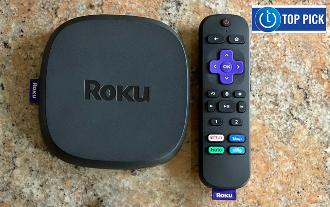 Roku Ultra box and remote sitting on stone counter top. Techlicious Top Pick logo in the upper right.