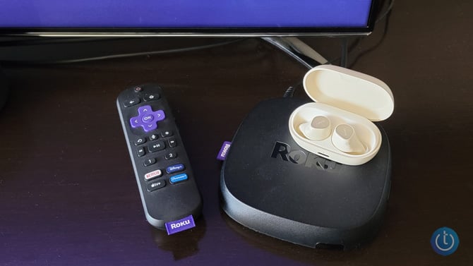 Roku Ultra with the Voice Remote Pro and Jabra Elite Pro 7 headphones on top.