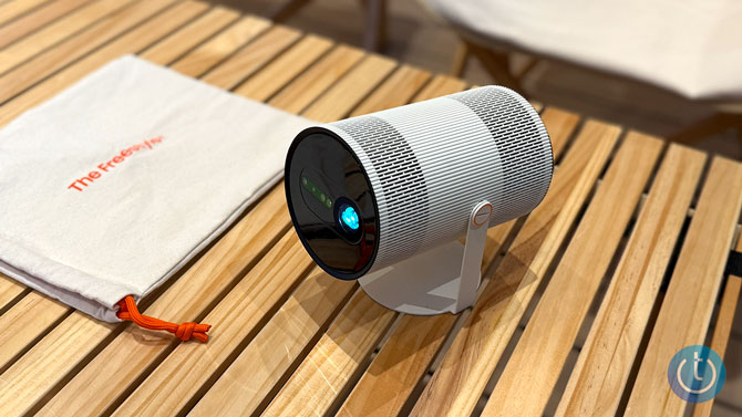 The Freestyle+ projector sits on a table