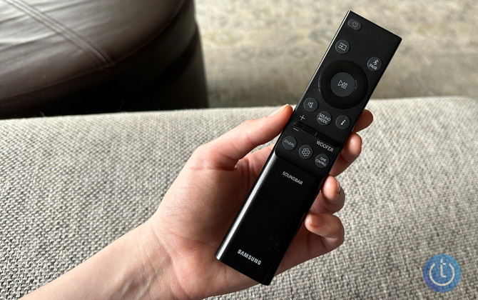 Samsung HW-Q800C Remote shown in a hand for size