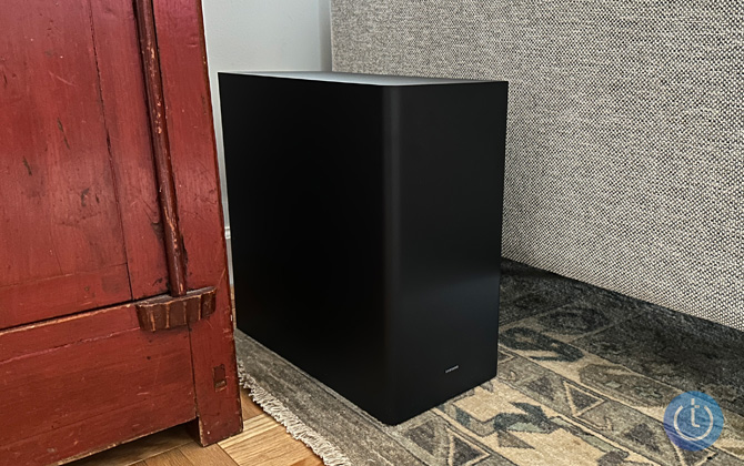 Samsung HW-Q800C subwoofer shown between a sofa and table for size