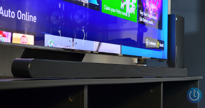 Samsung S800B Ultra-Slim on a black console under a TV showing the Samsung TV interface.