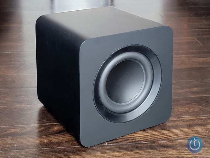 Samsung S800B Ultra-Slim soundbar subwoofer on wood surface shown three quarters angle from the front.