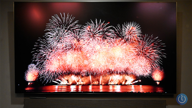 The Samsung S90H OLED TV shows fireworks on screen. Note the lack of reflections from the overhead lights.