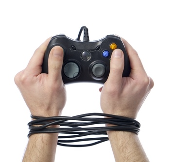 Hands tied by video game controller