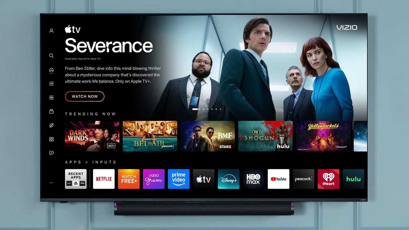Wall-mounted Vizio TV displaying its smart TV home screen with Severance featured, streaming app icons below, and a soundbar underneath.
