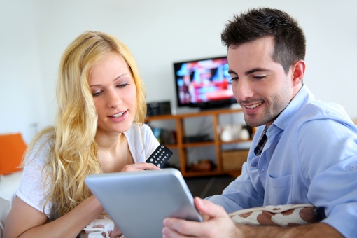 Young couple watching streaming video