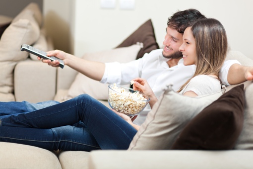 Young couple watching TV