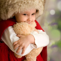 child holding bear