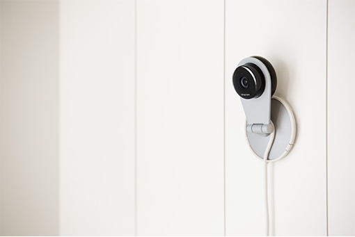 Dropcam HD video camera mounted on a wall