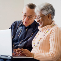 Senior couple with laptop