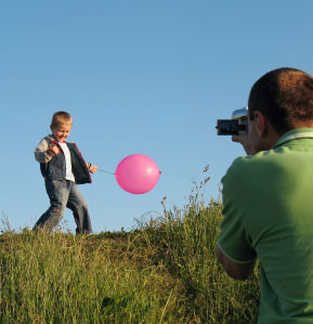 father shooting home video