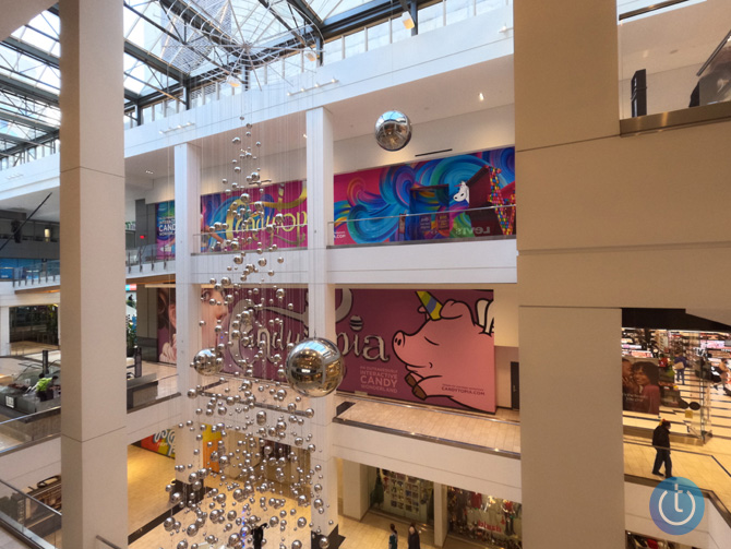 Image taken by GoPro Hero10 with HDR turned on and saved in the camera as a JPEG file. The scene is looking down and across a mall courtyard with a reflective ball art installation hanging down from the ceiling.