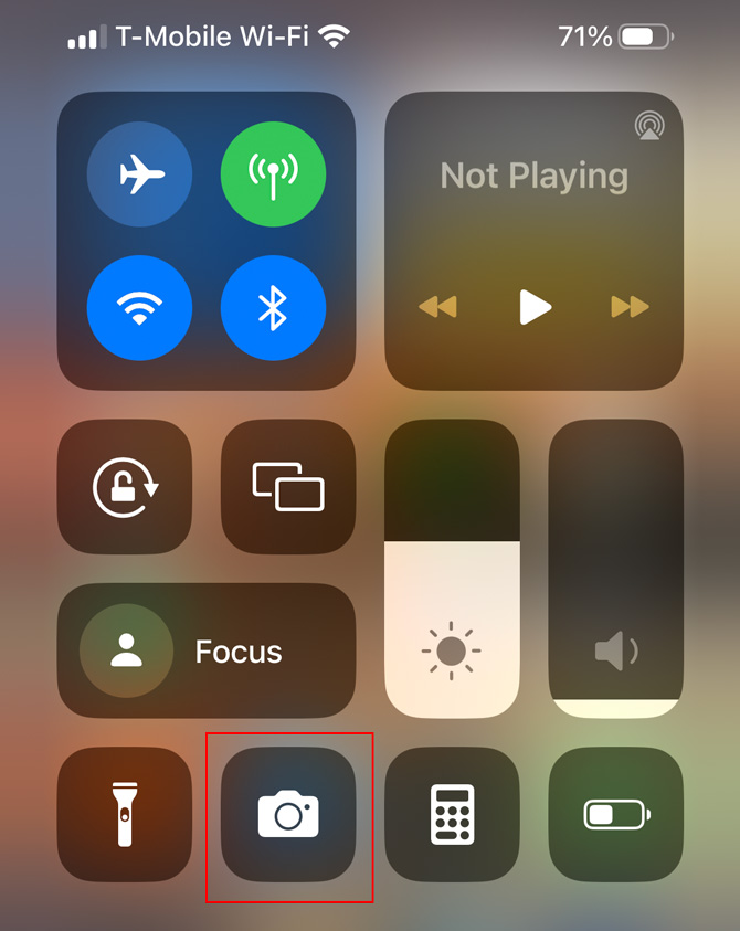 Screenshot of iOS Control Center with the camera icon in a red box.