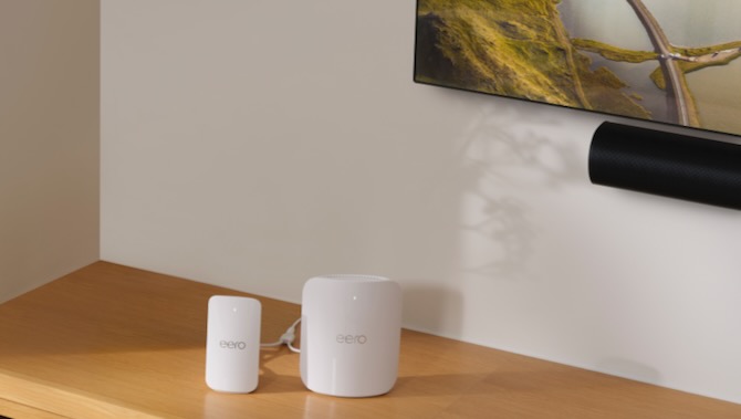 lluatration of amazon eero wifi 7 routers on a table in front of a tv