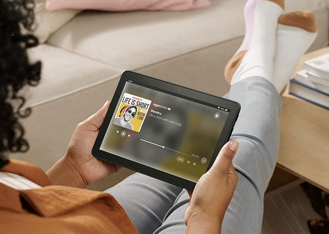 A person watches a video on the Amazon Fire HD 8 tablet