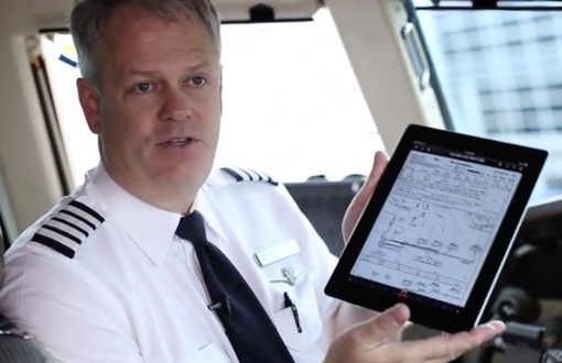 American Airlines pilot holding an iPad