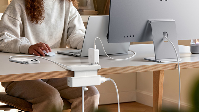Anker Nano Power Strip with a phone, monitor, and laptop plugged in