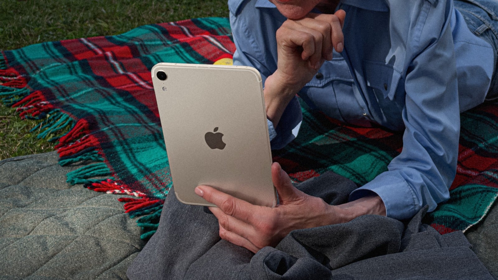 iPad mini held in a hand showing back side