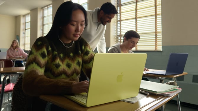 Student using Citrus MacBook Neo in classroom