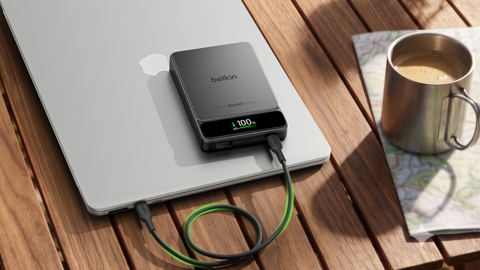 Belkin UltraCharge Pro charging a Macbook on a table