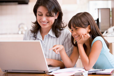 woman and girl with computer