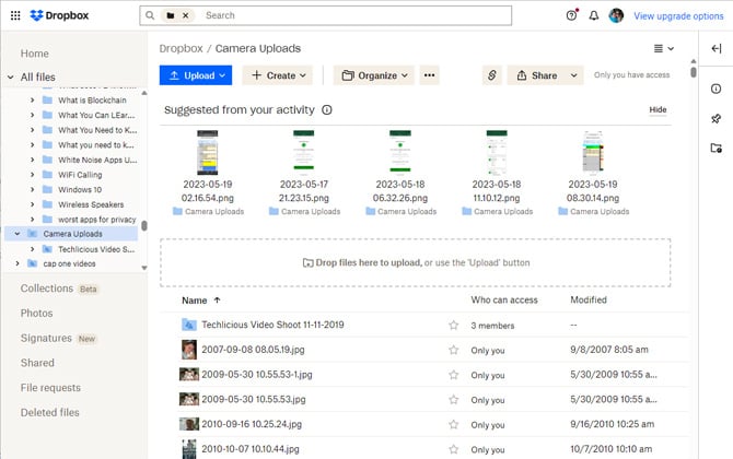 Screenshot of Dropbox showing the camera uploads folder with a detailed list of files