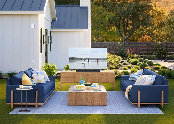 The eero Outdoor 7 is shown installed on the side of a home.