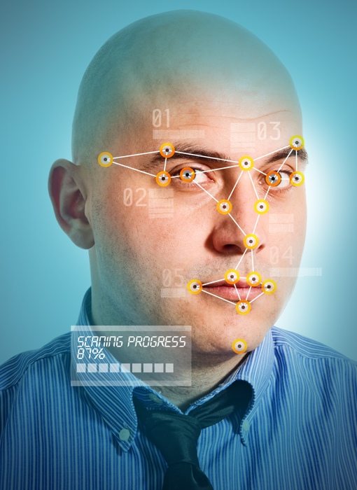 Facial recognition scan of a bald businessman's face