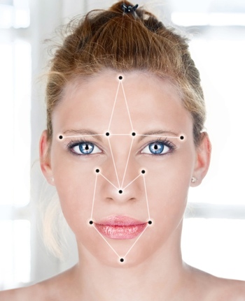 A woman's face being scanned by facial recognition software