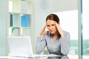 Frustrated woman at computer