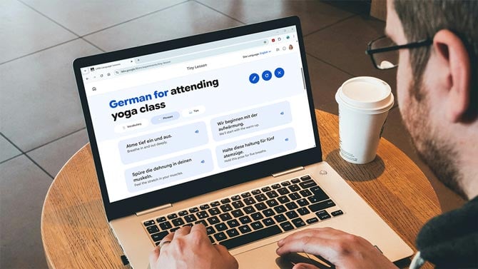 A laptop shows a German language lesson for attending a yoga class