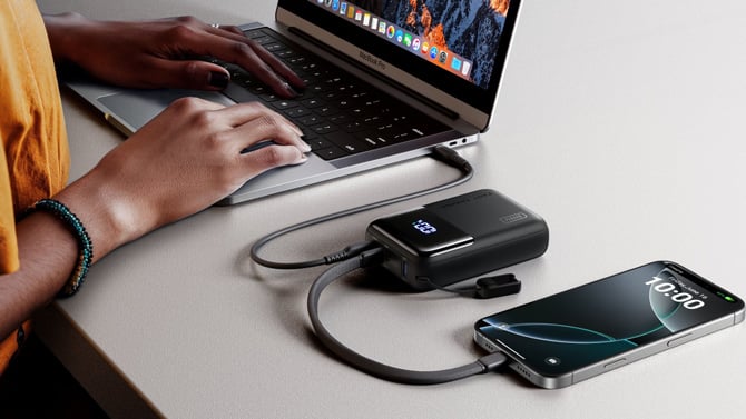 The INIU Cougar P63 is shown powering a laptop and iPhone