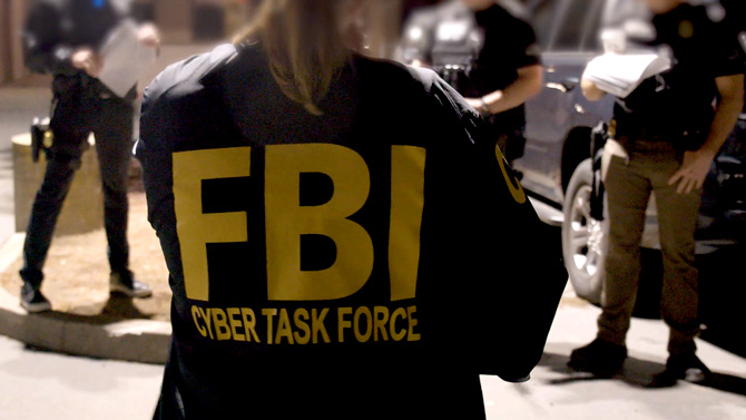 A member of an FCyber Task Force joins her law enforcement colleagues in preparing for a Joint Criminal Opioid and Darknet Enforcement (JCODE) team operation in 2021