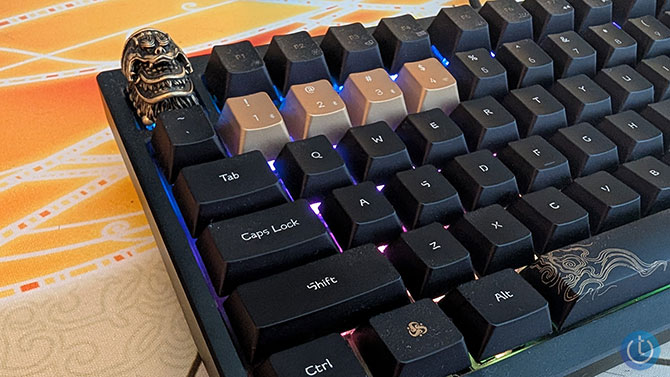 A closeup of the Keychron Black Myth Wukong keyboard's Ebongold Silk Robe Spaulder keycap installed on the keyboard. 