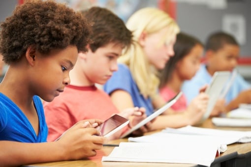 Kids in school using tablet computers