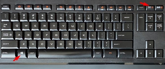 Computer keyboard with Windows and PrtScr keys identified with arrows