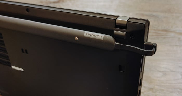 Lenovo Go Wireless Charging Kit shown mounted on the back of a laptop and plugged into the USB-C port