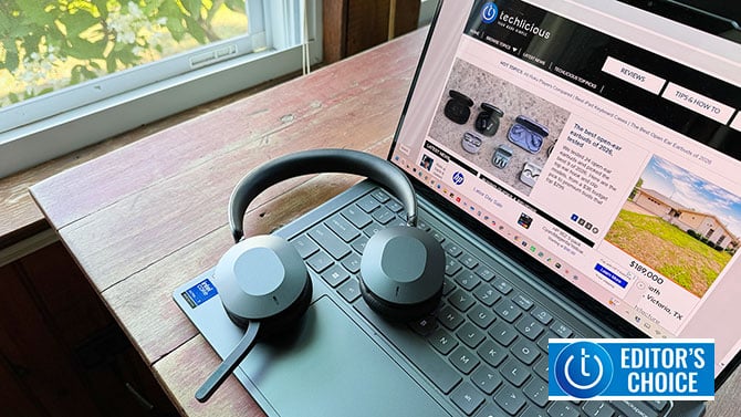The Lenovo ThinkPad Dual-Mode 8550 headset rests on a laptop keyboard