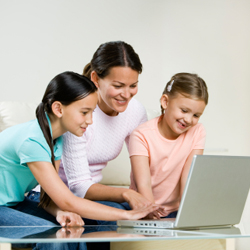 mother with two children and a computer