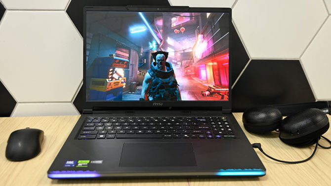 MSI Raider 16 shown on desk with Cyberpunk 2077 on the display