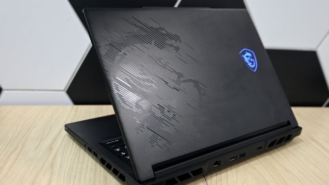 Back lid of MSI Raider 16 Max showing dragon design and mascot